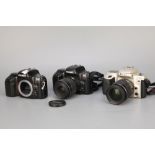 Three Nikon F50 SLR Cameras,