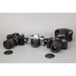 Three SLR Cameras,