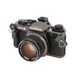 An Olympus OM-3 Ti SLR Camera,