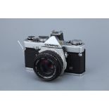 An Olympus OM-1n SLR Camera,