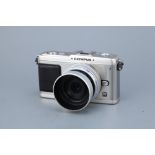 An Olympus Pen E-P1 Digital Camera,