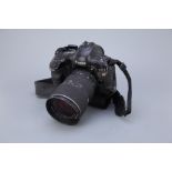 A Canon EOS 1V SLR Camera,