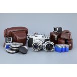 * A Voigtlander Prominent Rangefinder Camera,