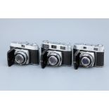 * Three Kodak Retina Cameras,