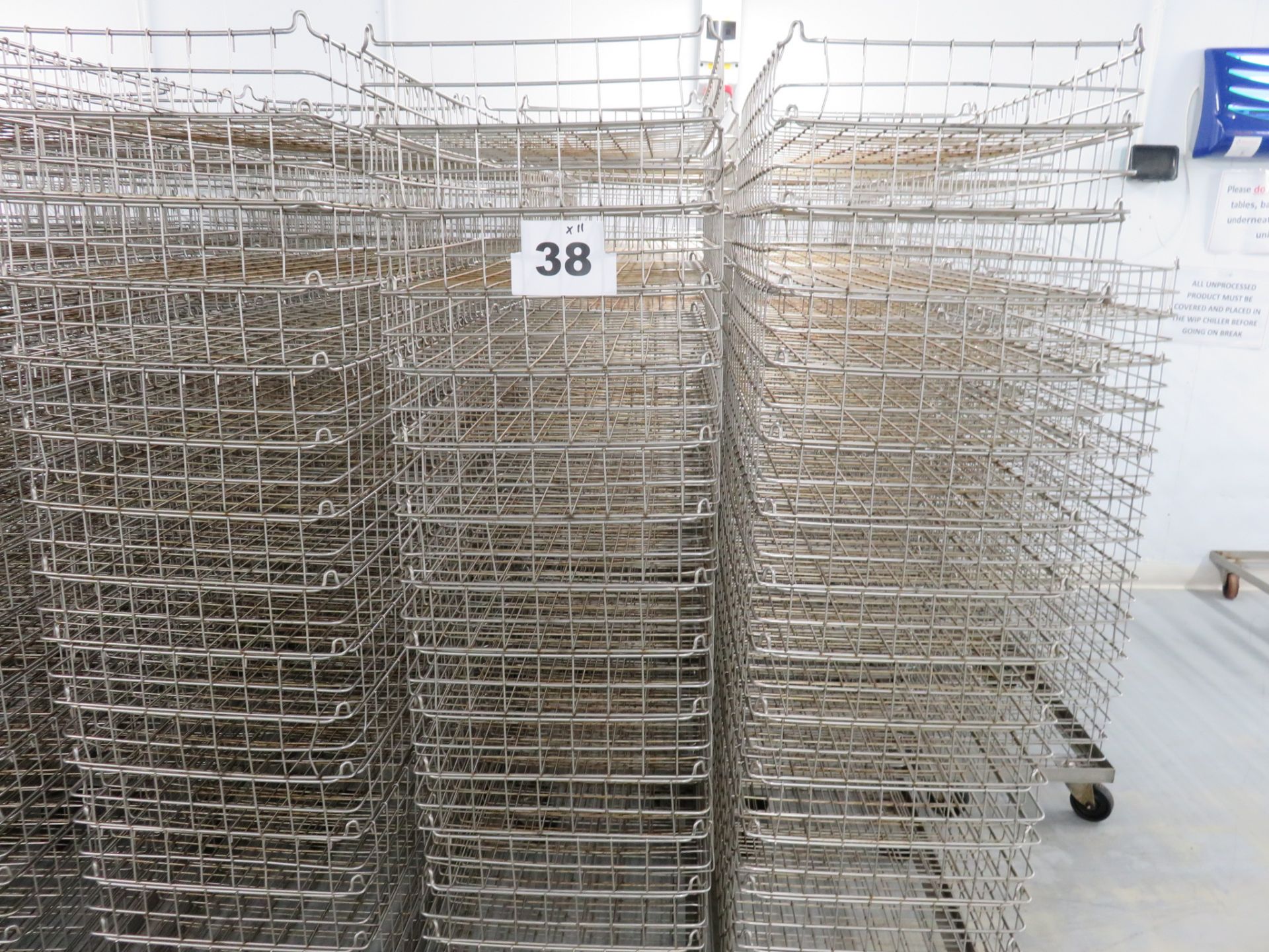 QUANTITY OF INTERLOCKING MESH BASKETS ON DOLLIES.