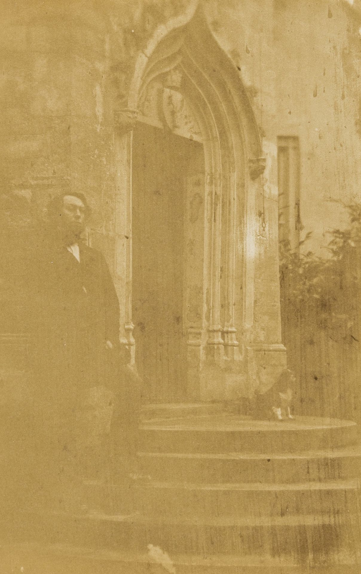 Photographs.- Man standing on steps in front of arched doorway with spaniel, ?salt print, [1850s] … - Image 3 of 4