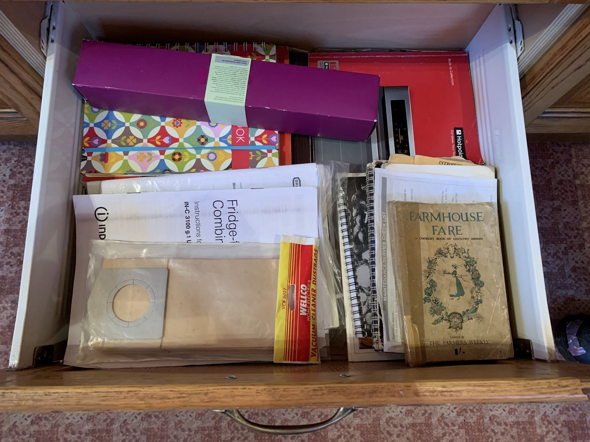 Contents of drawer including recipe books