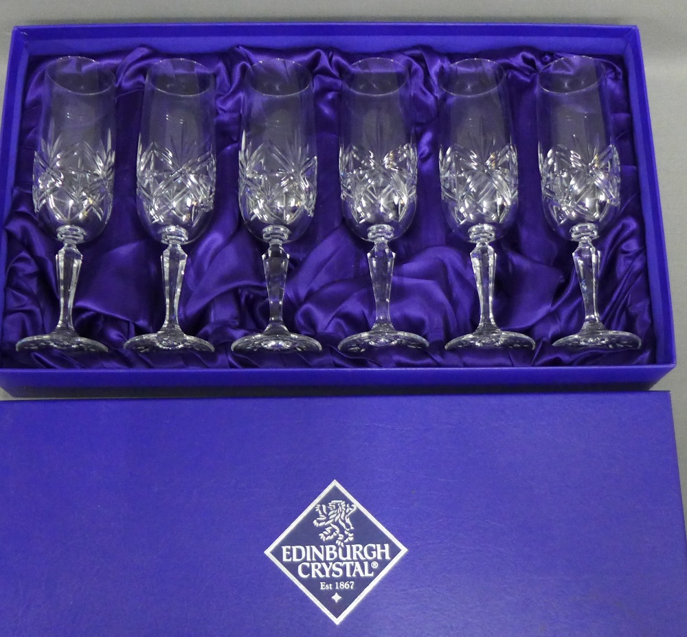 A set of six Edinburgh Crystal champagne glasses, boxed