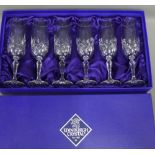 A set of six Edinburgh Crystal champagne glasses, boxed