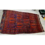 Large Belouch rug, the red field with blue lattice motifs, 394 x 228cm