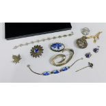 A collection of silver and white metal jewellery to include delft brooch, earrings and bracelet etc,