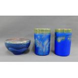 Pair of blue glazed and gold lustre studio pottery vases, together with a bowl with printed back