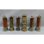 A collection of Stevenson's safety lamps and a Protector lamp and Lighting Co Ltd lamp, No.1943,