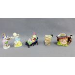Mixed lot to include a Staffordshire figure, gold anchor porcelain figure, two character jugs and