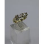 An 18 carat white gold five stone diamond ring, UK ring size K