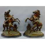 Pair of bronze patinated Spelter Marley Horse figures on ebonised oval plinth bases, 42cm high, (2)