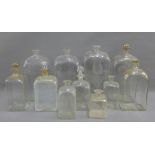 Collection of 19th century glass flasks and bottles, some with stoppers, some with gilt borders