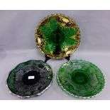 Pair of green glass and silver overlay moulded plates, together with another with gilt floral