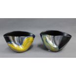 Margery Clinton, a pair of black glazed squat vases with yellow lustre pattern and pinched top