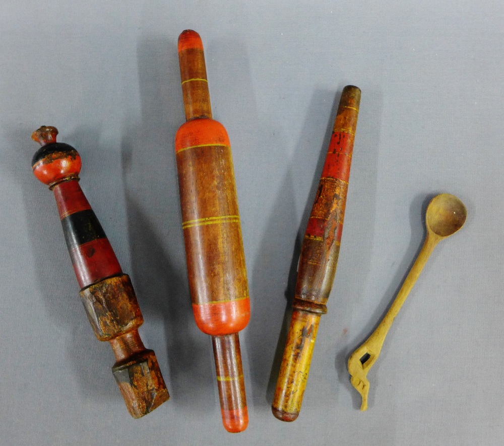 Collection of three Indian wooden painted sweet making utensils and a wooden spoon, (4)