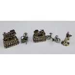 A collection of silver and white metal miniatures to include a chair, telephone and bicycle, etc (5)