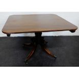 19th century mahogany breakfast table, the rectangular top with rounded edge, on a spiral carved