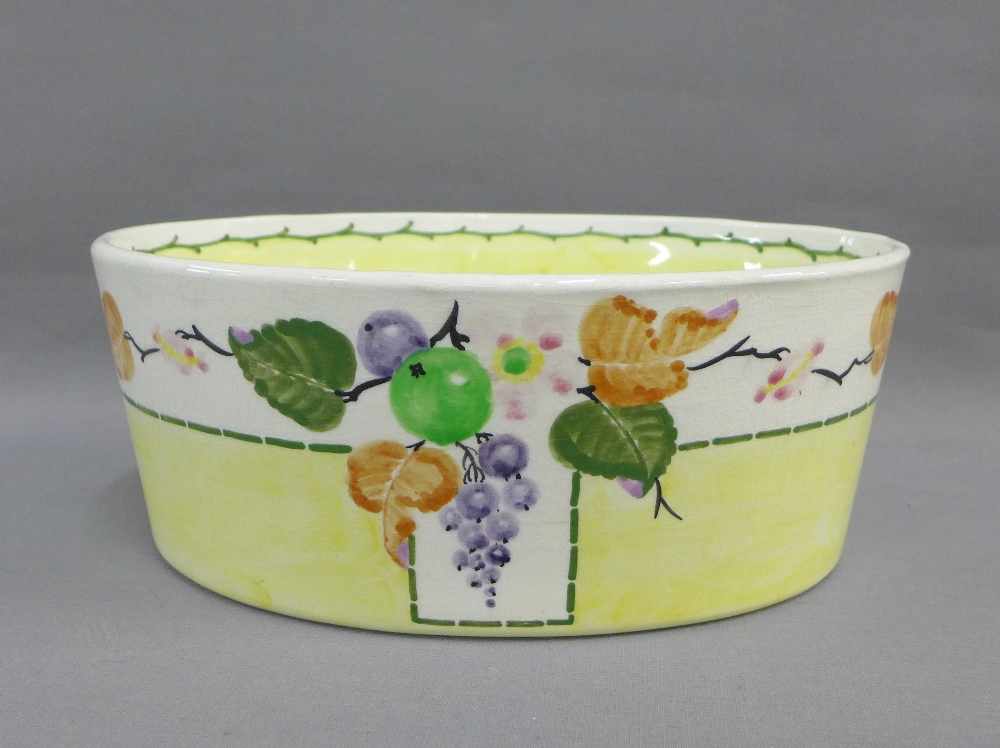 Mak Merry Scottish pottery oval bowl painted with fruit and flowers to a yellow and white ground,