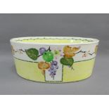 Mak Merry Scottish pottery oval bowl painted with fruit and flowers to a yellow and white ground,