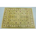 Contemporary woollen rug, the beige field with allover foliate pattern, 120 x 179cm