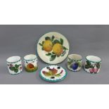 Collection of Wemyss ware to include four pottery jars, 5cm high, and two small plates in various