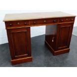 19th century mahogany desk, the rectangular top with rounded edges, over three frieze drawers,