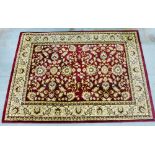 Contemporary woolen rug, the red field with allover foliate pattern, 120 x 170cm