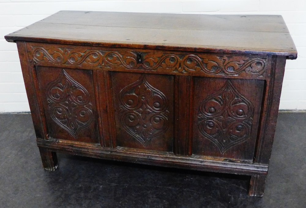 18th century carved oak coffer, with hinged top and triple panelled front, 74 x 120cm