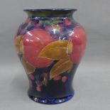 Moorcroft baluster vase, tubeline decorated in the Pomegranate pattern, facsimile signature and