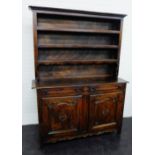 19th century provincial French oak dresser with a shelved back above two drawers over a pair of