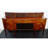 Georgian mahogany, satinwood and inlaid sideboard with four tambour doors above a bow front top,