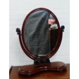 Mahogany dressing table mirror, with an oval plate and serpentine base, 88 x 72cm