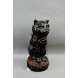 Early 20th century English stoneware 'Good Luck' black cat figure, on a circular base, 21cm