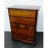 Stag chest, the rectangular top with moulded edge over an arrangement of seven drawers, 113 x 84cm