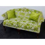 Contemporary two seater sofa with green floral pattern and scatter cushions , 96 x 172cm