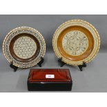 Japanese lacquered box, together with two abalone and bone inlaid wooden plates, (3)