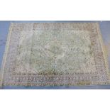 Rug with green and beige field with central medallion, 240 x 160cm