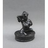 Japanese erotic Netsuke of a lady bathing, signed