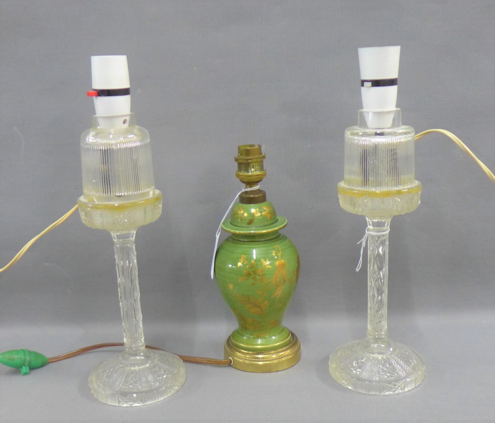 Pair of cut glass table lamp bases, 27cm high excluding fittings and a green pottery baluster