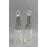 A pair of Victorian silver mounted and cut glass decanters, with stoppers, Birmingham 1897, 21.5cm
