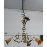 Brass three branch ceiling light with orange opaque glass shades, 80 cm