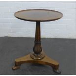 Mahogany and rosewood wine table with circular dished top, baluster column and tripod base with pad
