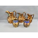 Group of five copper lustre jugs, tallest 22 cm, (5)