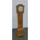 Oak Grandmother clock, with arched top and silvered dial with Arabic numerals, flanked by barley