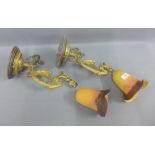 Pair of gilt metal wall lights with orange opaque glass shades, (2)